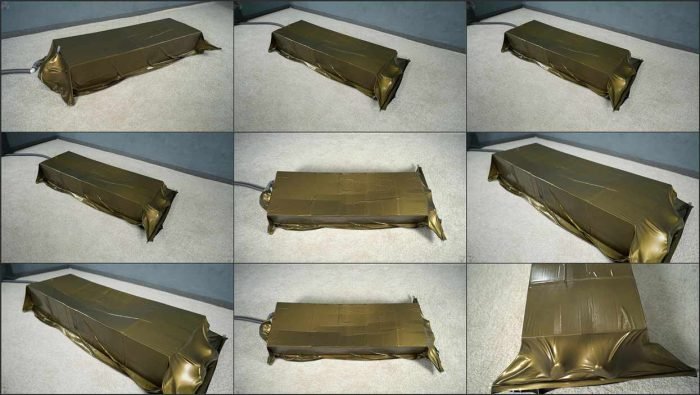 vcd Bondage by boxes in a gold vacuum bed1.mp4 700x395
